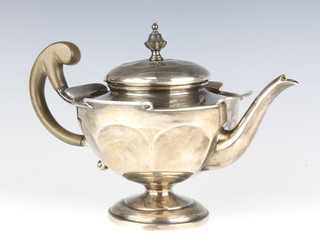 A silver teapot of pedestal form with fruitwood handle Sheffield 1918, gross weight 667 grams