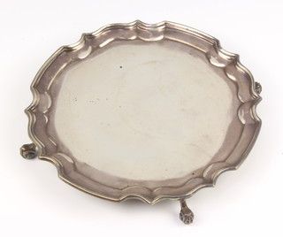 A Georgian style silver card tray with Chippendale rim on scroll feet Birmingham 1973, maker Alexander Clark and Co, 165 grams, 16cm 