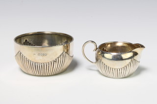 A Victorian silver demi-fluted cream jug and sugar bowl London 1882, 141 grams 