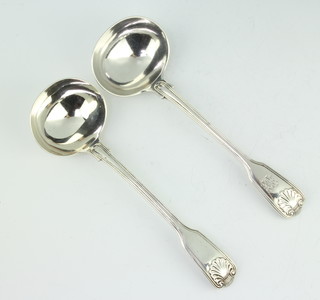 A near pair of Victorian silver fiddle pattern sauce ladles London 1880 and a later ditto, both are made by George W Adams 172 grams 