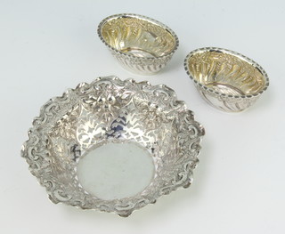 A Victorian repousse pierced silver bon bon dish, a pair of oval salts, Sheffield 1893, 127 grams 