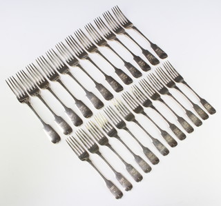 Twelve Victorian silver fiddle pattern dessert forks and 12 matching dinner forks all with matching armorial, London 1858, 1306 grams
