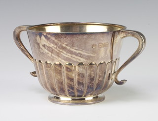 A Victorian demi-fluted silver 2 handled cup, London 1897, 8cm, 208 grams