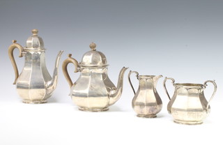 An octagonal silver 4 piece tea and coffee set with fruitwood mounts Sheffield 1919 and 1921, 1552 grams gross 