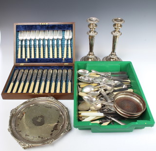 A cased set of 12 Edwardian silver plated fish eaters, a pair of candlesticks, salver and coaster  and a quantity of plated cutlery