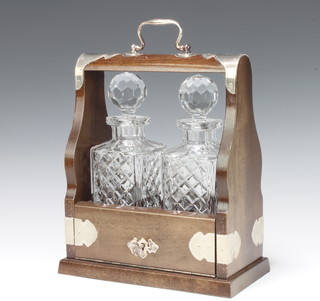 A silver plated mounted 2 bottle tantalus 