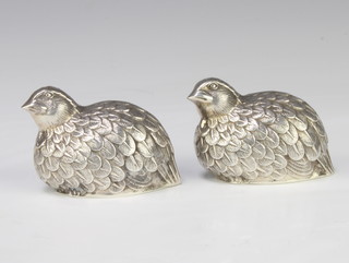 A pair of Continental repousse silver condiments in the form of quail 7cm, 70 grams