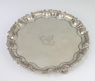A Victorian silver card tray with Chippendale rim on scroll acanthus feet with chased armorial London 1892, maker Edward Hutton, 20.5cm, 477 grams 
