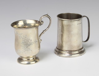A silver mug of tapered form Birmingham 1943 8cm, a baluster ditto 182 grams 