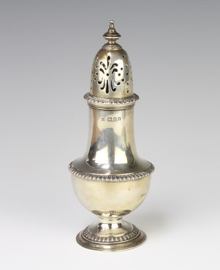 A silver sugar shaker of Georgian design, London 1929, 19cm, 197 grams