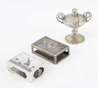 An Egyptian silver niello match sleeve, 1 other and a lamp/lighter  109 grams
