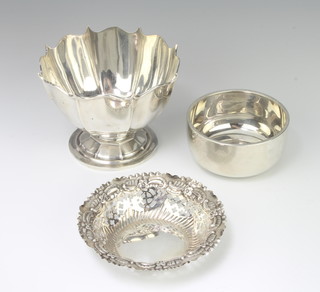 An Edwardian pedestal silver bowl Sheffield 1904, a plain ditto and a pierced bon bon dish 228 grams