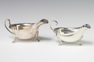 A silver sauce boat on pad feet Sheffield 1966, a  smaller ditto with rubbed marks, 170 grams