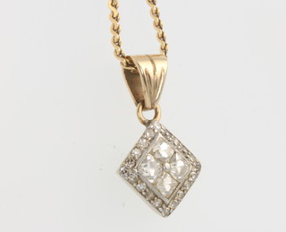 A 9ct yellow gold diamond set pendant and chain, gross 5.5 grams 