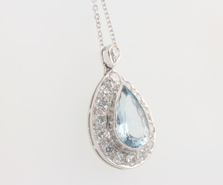 A white gold pear cut aquamarine and diamond pendant, the centre stone approx. 2ct surrounded by brilliant cut diamonds approx. 0.9ct 23mm on an 18ct white gold chain 