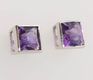A pair of white gold square cut amethyst ear studs 