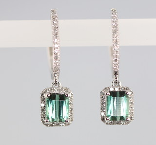A pair of 14ct white gold green tourmaline and diamond rectangular ear drops, the centre stone 1.8ct, the diamonds approx. 0.4ct 