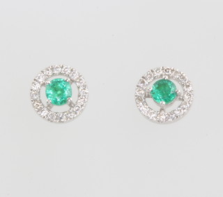 A pair of 9ct yellow gold emerald and diamond circular ear studs 5mm 