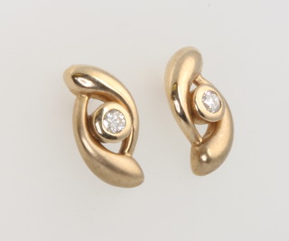 A pair of yellow gold diamond set ear studs 11mm 