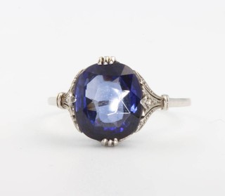 A 1930's white gold synthetic sapphire and diamond dress ring, the centre stone 12mm x 10mm, size U 1/2