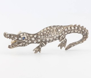 An Edwardian style gold and silver diamond crocodile brooch with sapphire set eye 45mm  
