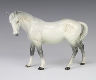A Beswick figure of a mare horse (facing left) no.976 in rocking horse grey by Arthur Gredington 17.2cm 