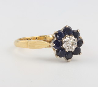 An 18ct yellow gold diamond and sapphire cluster ring 3.2 grams size K 1/2