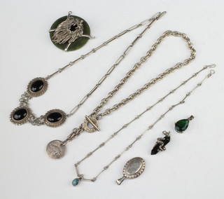 A silver locket and minor silver jewellery, gross 158 grams 