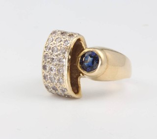A 14ct yellow gold diamond and sapphire cocktail ring 7 grams