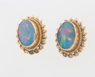 A pair of 9ct yellow gold oval opal ear studs 10mm 
