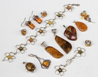 A silver mounted compressed amber pendant and other silver mounted jewellery 