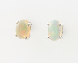 A pair of silver Ethiopian opal studs 