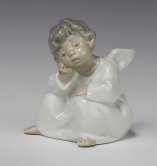 A Lladro figure of a seated angel 10cm 