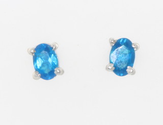 A pair of silver neon apatite studs 