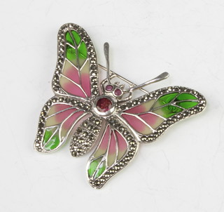 A silver, enamel, marcasite and ruby butterfly brooch set with a tourmaline  