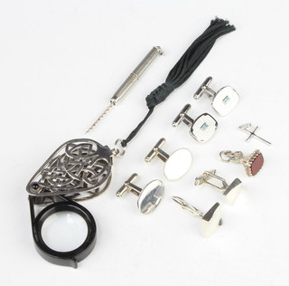 A silver mounted eye glass, a ditto scent bottle corkscrew, seal, cross and 3 pairs of cufflinks 
 