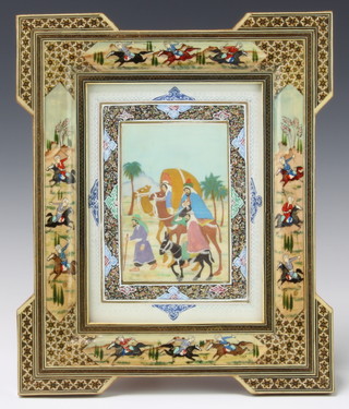 A Persian painted miniature depicting figures on camels contained in a painted frame decorated with warriors on horseback 37cm x 30cm