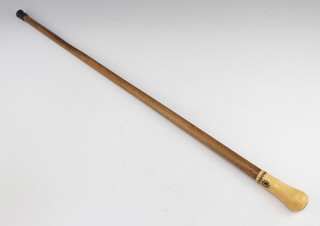 A Regency walking cane the ivory knop with geometric silver wire inlay 85cm