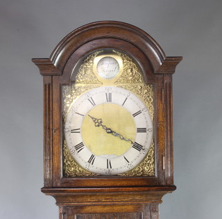 Bravingtons, a 1920's chiming longcase clock with 30cm gilt arched dial and silvered chapter ring, striking on gongs contained in an oak case 211cm h 
