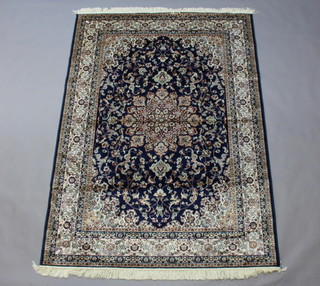 A blue ground Keshan carpet 230cm x 160cm