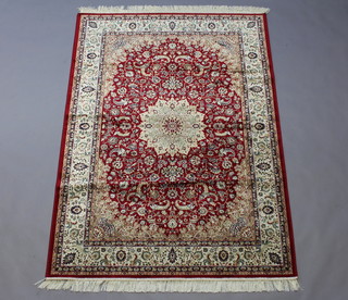 A red ground Keshan rug 200cm x 140cm