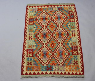 A multi coloured Chobi Kilim rug with geometric designs 152cm x 100cm 