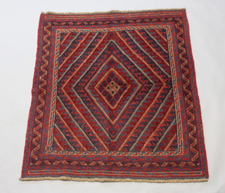 A red and blue ground Gazak rug with diamond shaped medallion within a multi row border 130cm x 119cm 