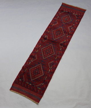 A red and blue Meshwani runner with 4 stylised diamonds to the centre 242cm x 62cm 
