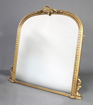 A Victorian style arched plate over mantel mirror contained in a decorative frame 119cm x 125cm 