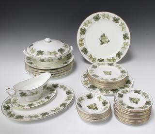 A Royal Worcester dinner service Mathon pattern comprising 16 side plates, 8 hors d'oeuvres plates, 8 large plates, 6 dessert dishes, tureen and lid, sauce boat and stand, a large serving plate and platter  