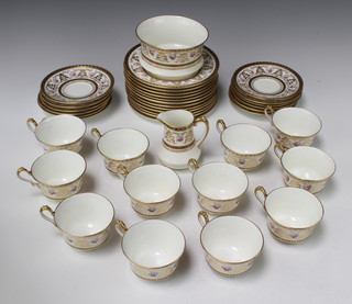 A Cauldon tea set comprising 12 tea cups, 12 saucers, 12 side plates, sugar bowl and cream jug decorated with roses 