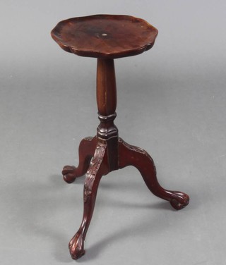 A Georgian style mahogany circular kettle stand with bracketed border, raised on a chamfered column and tripod base with egg and claw feet 54cm x 26cm diam.  