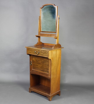 An Edwardian ships style wash stand with arched plate mirror, the base fitted a drawer with cupboard and recess, raised on bracket feet, the reverse labelled Mars Jones-Gribb & Co. 169cm h x 55cm w x 43cm d 