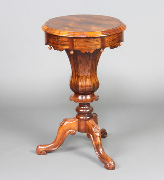 A Victorian rosewood work table of bell form raised on cabriole supports 74cm x 45cm 

